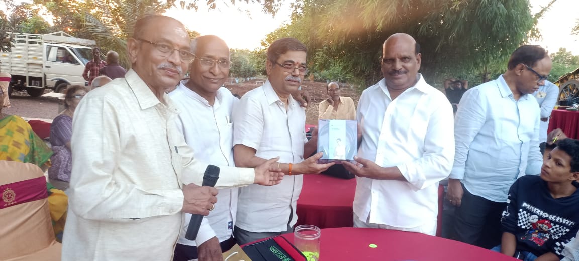 V. Narasimha Rao Garu receivin prize as Lucky Man of the Day in get-together party held on 22-11-2023.
